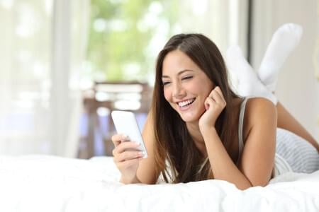 Girl smiling on phone